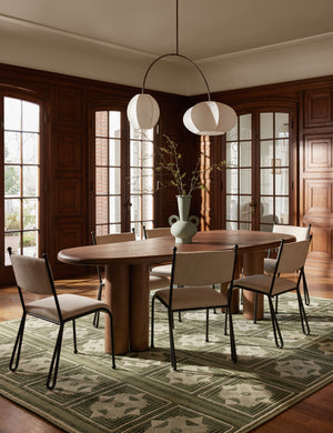 Dining room featuring the Nave modern sculptural red oak dining table by Aimee Song