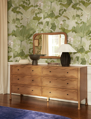 Galilea solid wavy wood frame mirror mirror by Aimee Song hung on the wall above a dresser