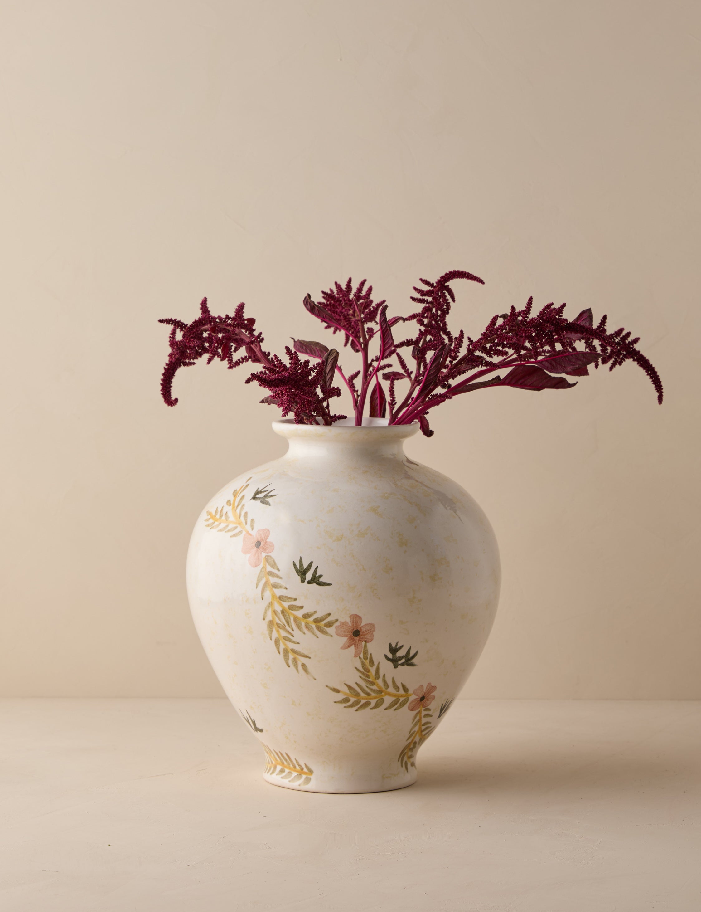 #color::ivory | Bea floral motif ceramic vase by Heidi Caillier filled with red florals.