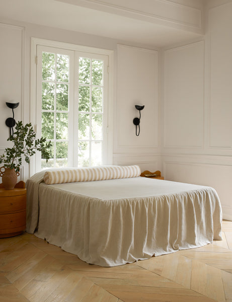 #color::natural-and-ivory | Painterly stripe linen long bolster throw pillow in natural and ivory styled on a bed