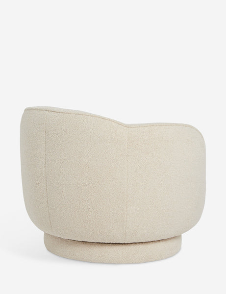 #color::teddy-boucle | Side view of the Fern scalloped back boucle upholstered swivel chair