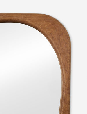 Close up view of the frame of the Galilea solid wavy wood frame mirror mirror by Aimee Song