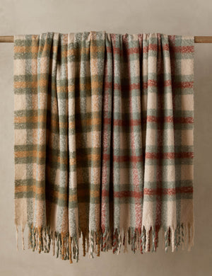 Both colorways of the Haldar chunky tasseled edge plaid throw.
