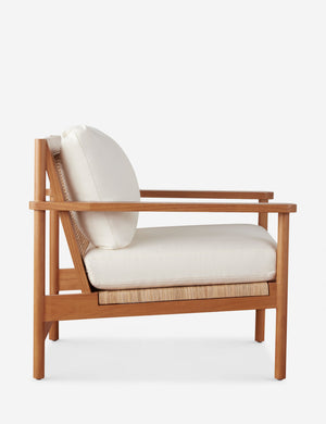 Side view of the Jutta woven can back accent chair.