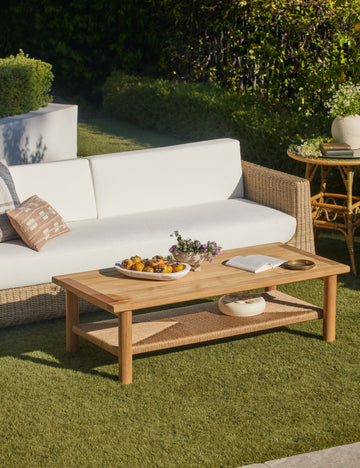 #color::natural | Gally teak and wicker outdoor coffee table and wicker outdoor sofa.