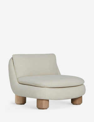 Angled view of the Lozano chunky low-profile armless accent chair.