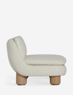 Side profile of the Lozano chunky low-profile armless accent chair.