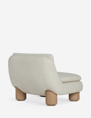 Angled back view of the Lozano chunky low-profile armless accent chair.
