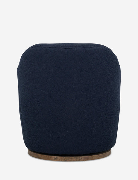 #color::navy | Rear view of Margie rounded barrel swivel accent chair in navy