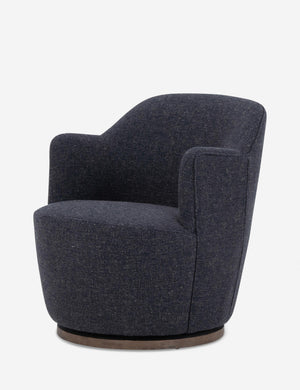 Angled side view of Margie rounded barrel swivel accent chair in slate