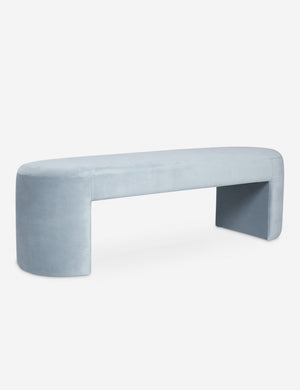 Angled view of the Mikhail light blue velvet foam-padded bench.