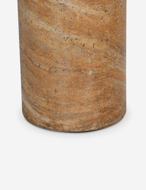 Close up of the Mona round stone drink table.
