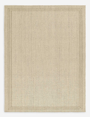 Greco low pile wool rug with accent border stitching.
