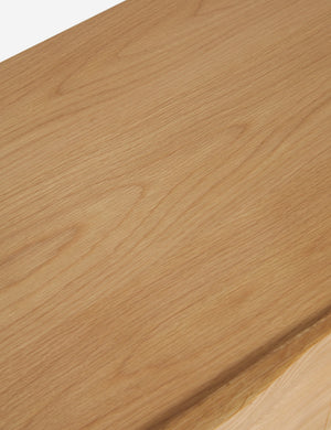 Woodgrain of the Otelia wide profile two drawer nightstand in natural wood