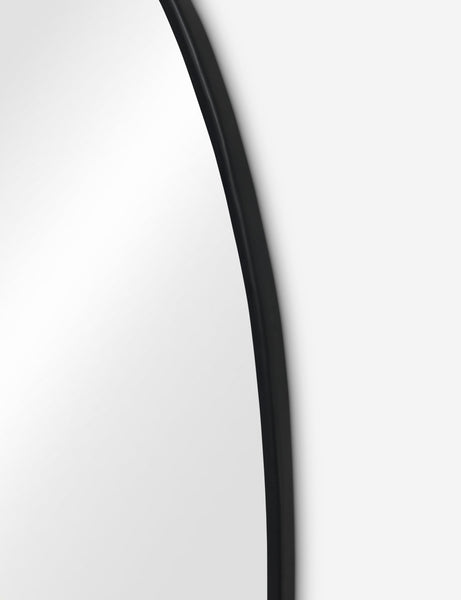 #color::black #size::large | Close up view of the Puddle slim frame wall mirror in charcoal