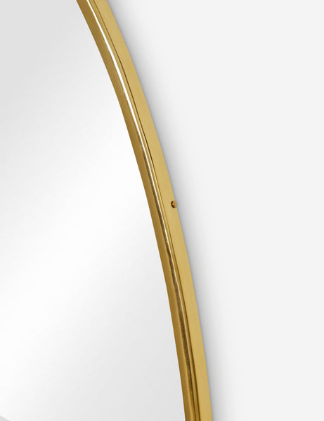 #color::gold #size::large | The gold curved frame on the large puddle mirror