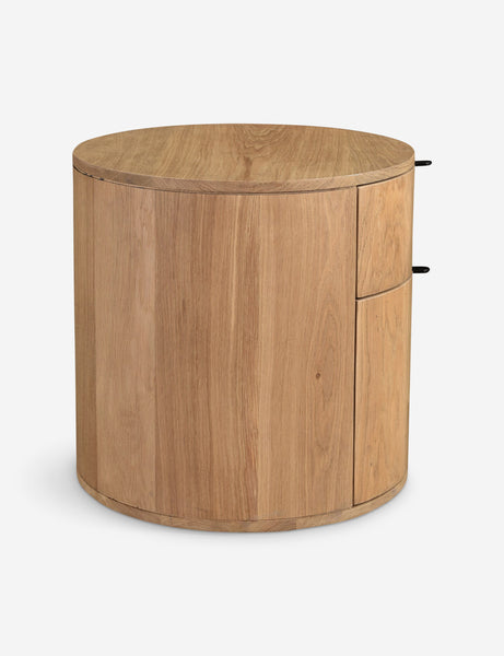 #color::natural | Side view of the Kono 2-drawer round oak nightstand.