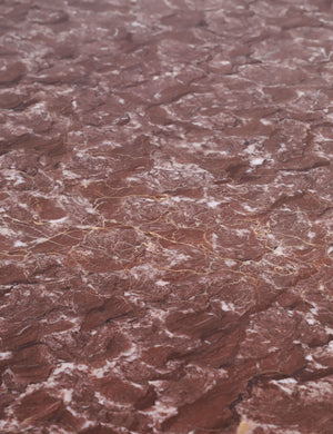 Close up of the top of the Ramoon wide leg solid marble dining table by Carly Cushnie.