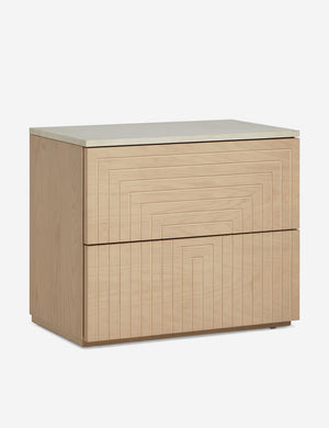 Angled view of the Rayner carved linear detailing oak two drawer nightstand.
