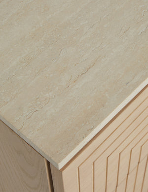 Close up of the top of the Rayner carved linear detailing oak two drawer nightstand.