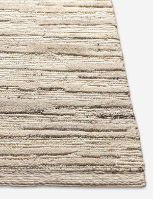 Corner of the Rizzoli natural rug