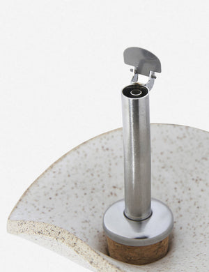 Close-up of the metallic spout on the Flora speckled eggshell glazed oil cruet by SIN ceramics