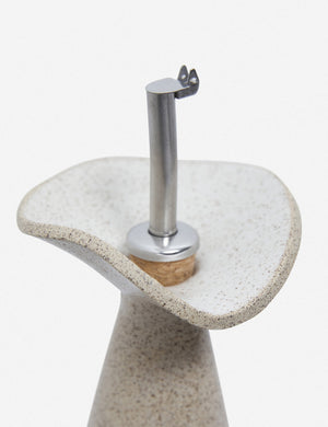 Close-up of the metallic spout on the Flora speckled eggshell glazed oil cruet by SIN ceramics