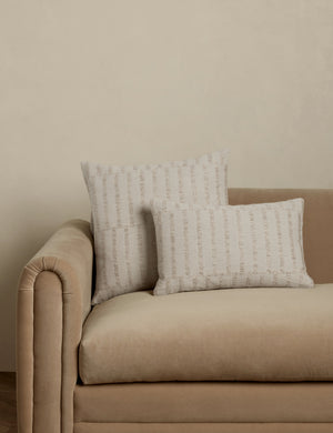 Thisbe offset stripe throw and lumbar pillows paired together on a sofa.