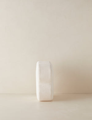 Side view of the Velvet clover shaped accent pillow in ivory