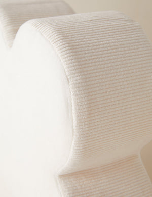 Close up view of the Velvet clover shaped accent pillow in ivory