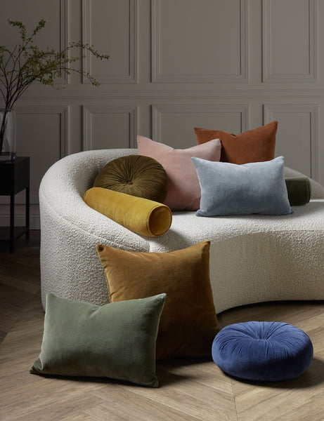 #color::moss #style::lumbar  #fill type::with-feather-down-insert  #fill type::pillow-cover-only |   Charlotte velvet pillow in moss, rosewater, ice blue, burnt orange, and toast sit next to and on a cream boucle lounger