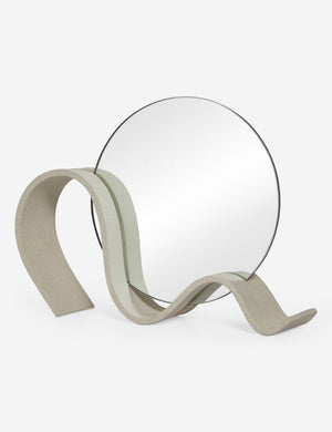 Angled view of the round Wavee Table Mirror by SIN Ceramics
