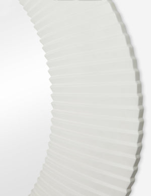 Close up of the Whitaker white asymmetrical oval wall mirror.