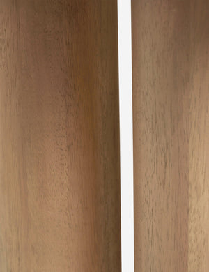 Close-up of the pedestal base on the Delta natural wooden side table