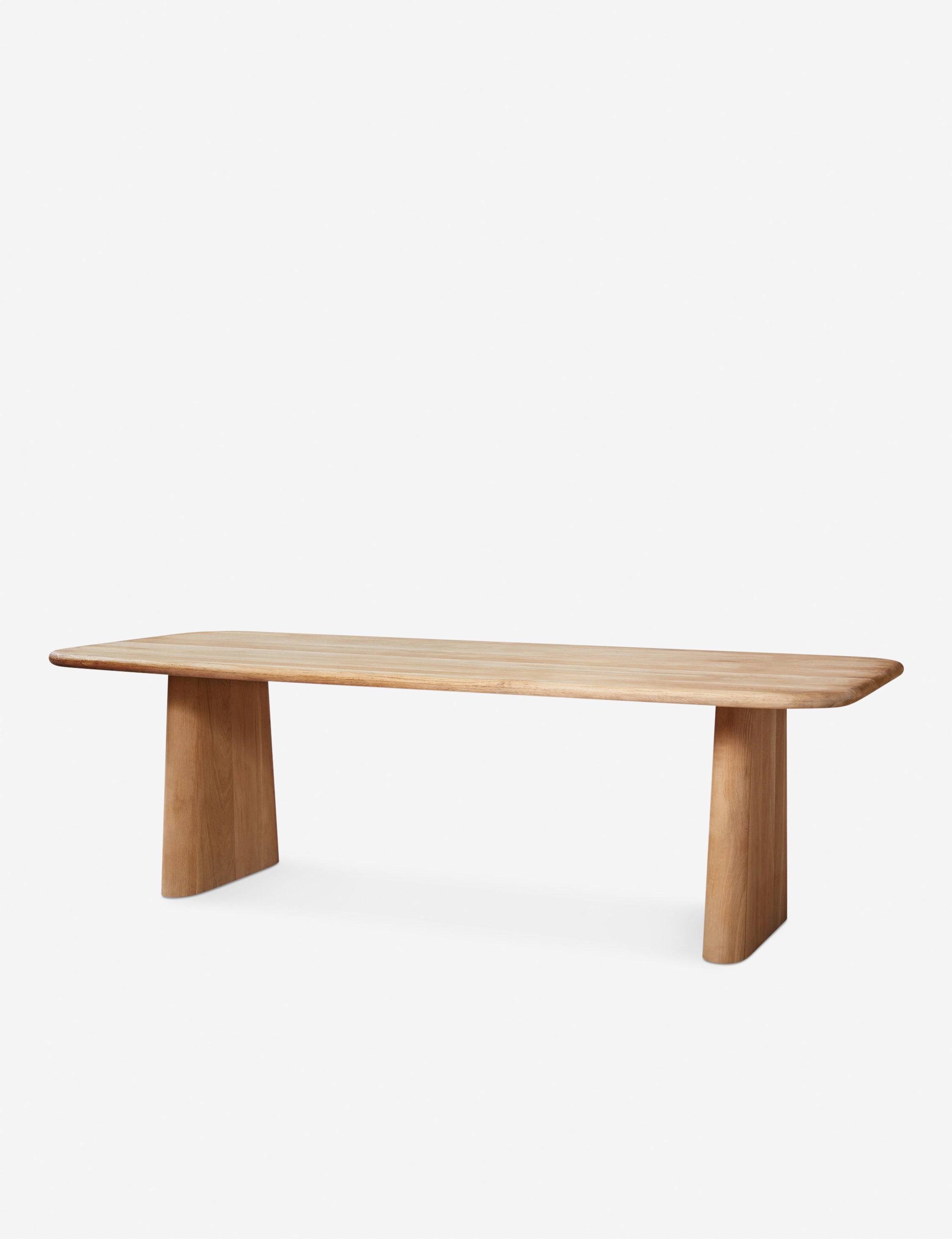#color::natural | Side view of Mela oak wood dining table.
