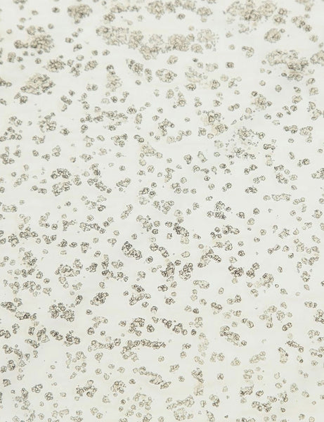 | Detailed view of the texture of the mirror ash glass top on the Bridget bronze pedestal side table