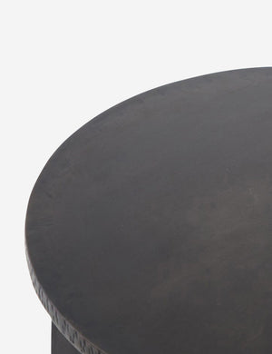 Close-up of the surface of the Illy metal geometric side table