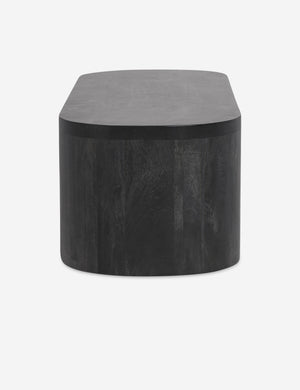 Side view of the Luna black wood oval coffee table.