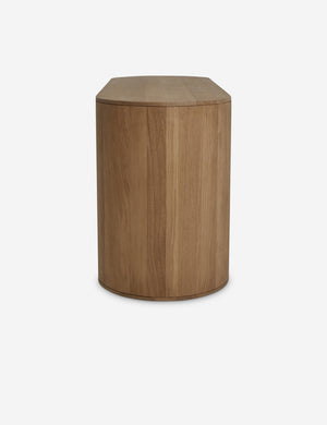 Side view of the Kono 6-drawer curved oak wide dresser.