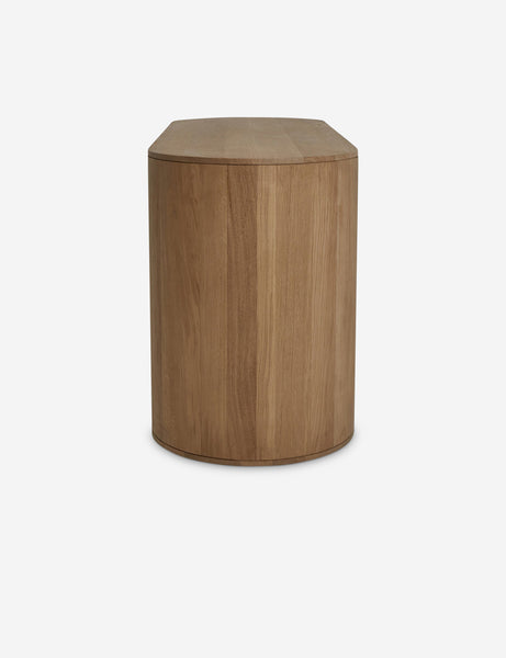 | Side view of the Kono 6-drawer curved oak wide dresser.