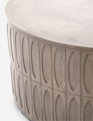 Close-up of the accented side on the Mal concrete indoor and outdoor round coffee table