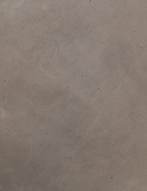 Detailed view of the concrete material in the Glyn concrete indoor and outdoor side table with carved finish
