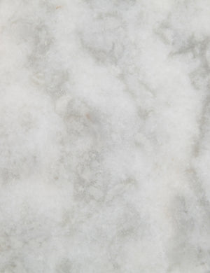 Marble detailing of the Evander brass frame and white marble bar cart.