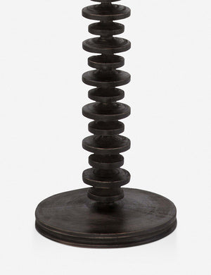 Close-up of the base of the Fishbone black ebony Floor Lamp by Regina Andrew with a gradated wooden base and linen drum shade