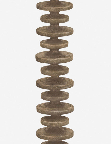 #color::Natural | Close-up of the base of the Fishbone natural wooden Floor Lamp by Regina Andrew with a gradated wooden base and linen drum shade