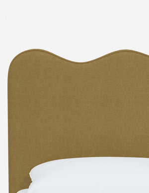 Close-up of the undulating lines on the headboard of the Clementine sesame linen platform bed