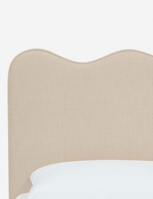 Close-up of the undulating lines on the headboard of the Clementine natural linen platform bed