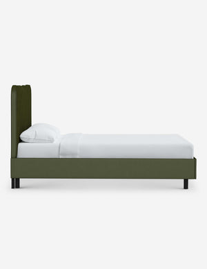 Side view of Clementine pine velvet platform bed with undulating lined headboard