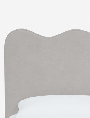 Close-up of the undulating lines on the headboard of the Clementine mineral velvet platform bed