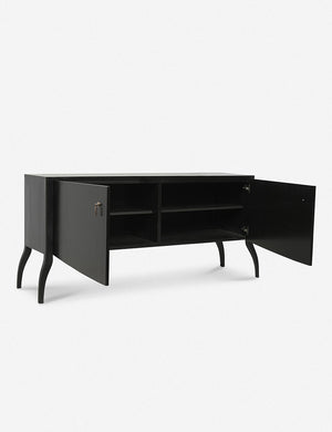 Angled view of the Anabella black wood console table with silver drawer pulls with both doors open, revealing the inner shelving